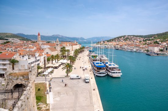 Enjoy a meal, a stroll, or excellent sunset by Trogir's lively promenade