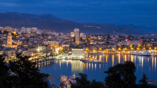 The port city of Split in southern Dalmatia lit up at night.