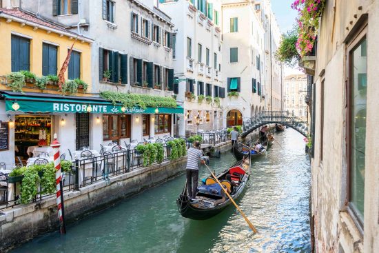 Take a gondola ride in the Venice canals to see the city in a truly unique way