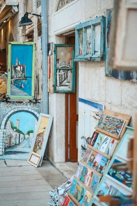 Artwork and prints displayed outside in Rab Old Town.