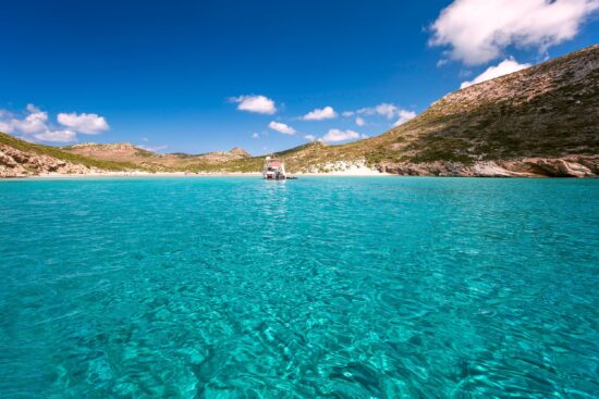 Clear transparent waters in Livadi sandy beach, Despotiko island in the Cyclades